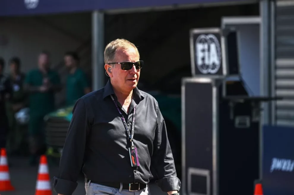 Martin Brundle once again stole the show at the Monaco Grand Prix—and lit up social media—with a trademark moment during his famous pre-race grid walk. The Sky Sports F1 broadcaster and former racing driver is known for navigating the packed start-finish straight, grabbing spontaneous interviews with drivers and celebrities. But at the 2026 Monaco GP, Brundle found himself face-to-face with a determined security guard protecting a VIP guest. Unfazed by the pushy bodyguard, Brundle delivered a line that instantly went viral: “Don’t push me, mate. I’m nearly famous.” Without missing a beat, Brundle kept moving, and the exchange was quickly picked up by fans online. Clips of the moment have racked up hundreds of thousands of views, with fans praising Brundle’s coolness and wit. As one fan wrote on X: “Every grid belongs to Martin, the rest are just visitors. They should show him some respect!” The latest episode only adds to Brundle’s legendary stat