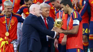 US President Donald Trump and FIFA President Gianni Infantino hands the World Cup trophy to Spain's Rodri ahead of the trophy lift in East Rutherford, New Jersey