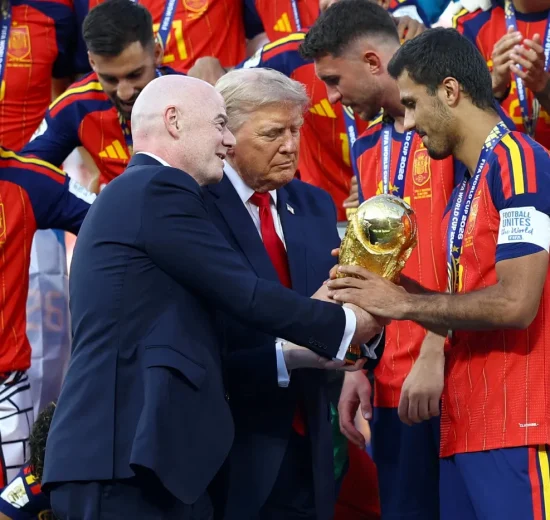 US President Donald Trump and FIFA President Gianni Infantino hands the World Cup trophy to Spain's Rodri ahead of the trophy lift in East Rutherford, New Jersey