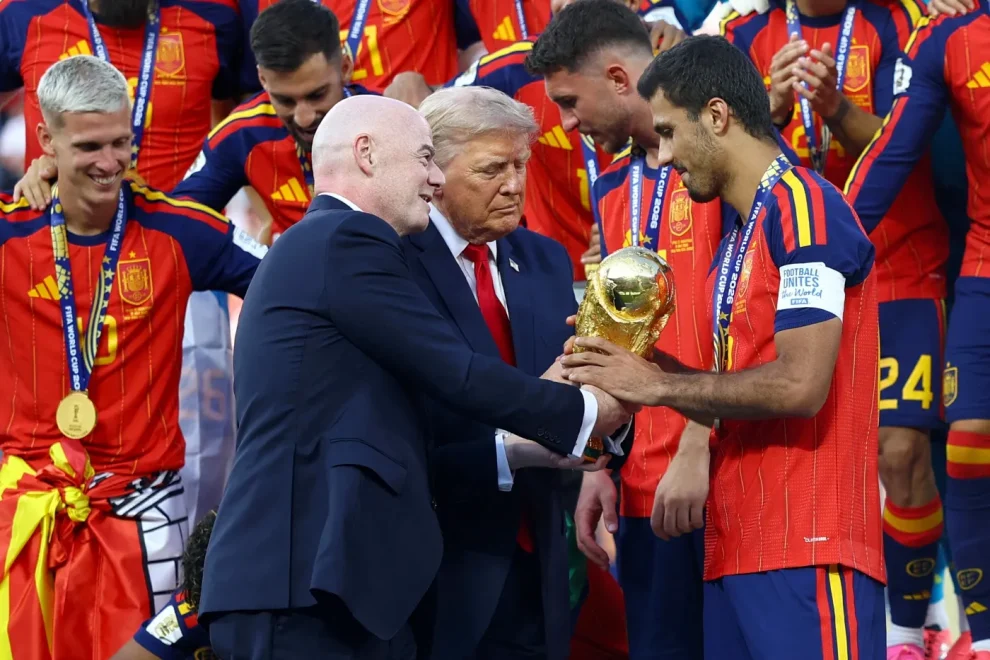 US President Donald Trump and FIFA President Gianni Infantino hands the World Cup trophy to Spain's Rodri ahead of the trophy lift in East Rutherford, New Jersey