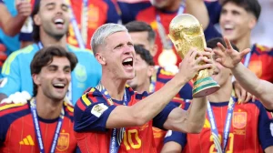 Spain’s Dani Olmo lifts the FIFA World Cup Winner’s Trophy.