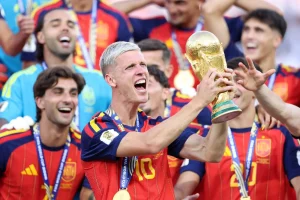 Spain’s Dani Olmo lifts the FIFA World Cup Winner’s Trophy.