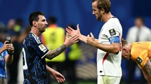 Argentina's Lionel Messi shakes hands with England's Harry Kane at the end of the match at the Atlanta Stadium.