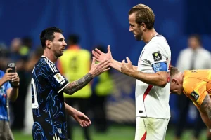 Argentina's Lionel Messi shakes hands with England's Harry Kane at the end of the match at the Atlanta Stadium.