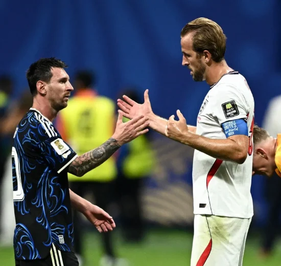 Argentina's Lionel Messi shakes hands with England's Harry Kane at the end of the match at the Atlanta Stadium.