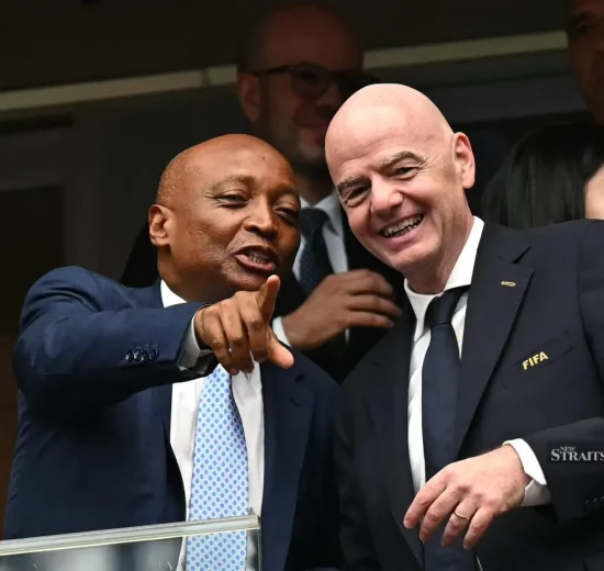 (Confederation of African Football (CAF) president Patrice Motsepe (left) and FIFA president Gianni Infantino during a World Cup round-of-16 match between Canada and Morocco at the Houston Stadium in Houston on July 4.