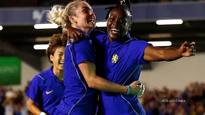 Melvine Malard (right) celebrates scoring with Ellie Carpenter during their Women’s Champions League match at Cherry Red Records Stadium, London, Britain, on Wednesday.